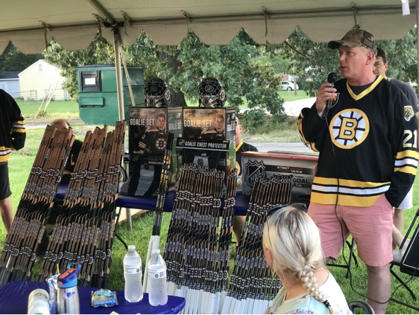 PSimonetti addressing crowd before handing out Boston Bruins Street hockey equipment at WFLF Summer Youth Campicture